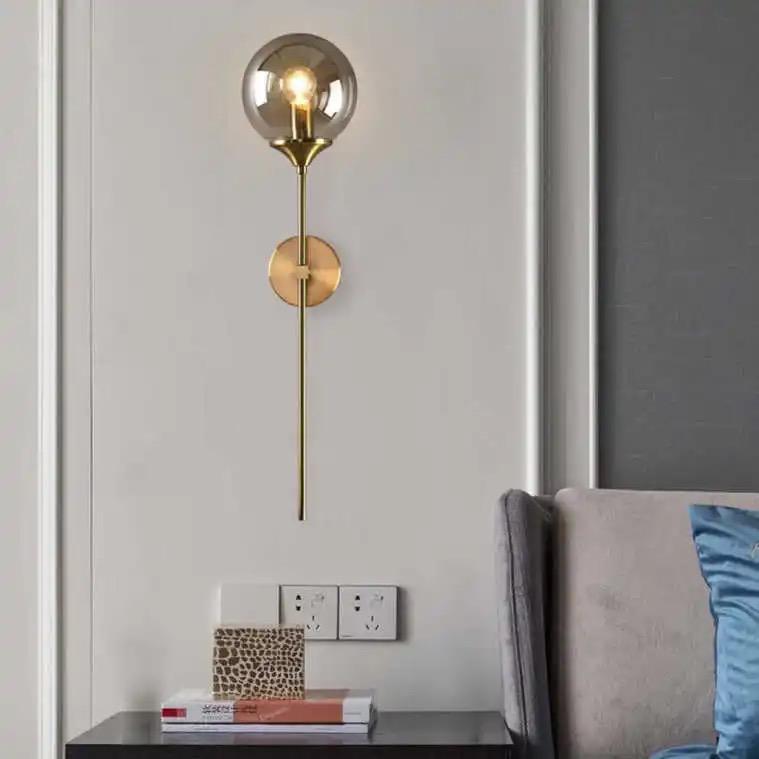 Modern Wall Sconce Light Fixture, Glass Globe Shade, Brass Finish, Long Stem Design