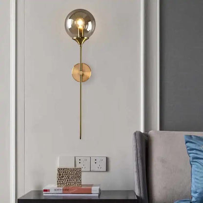 Modern Wall Sconce Light Fixture, Glass Globe Shade, Brass Finish, Long Stem Design